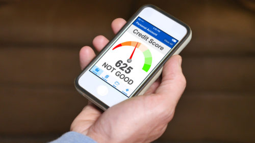 A “not good” credit score displayed on a mobile phone in a user’s hand