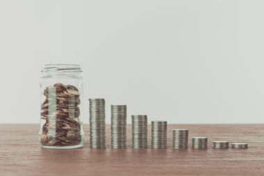 Tiered stacks of coins representing income levels