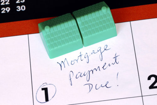 Close up of a calendar, with the words “Mortgage Payment Due!” written on the first day of the month and circled.