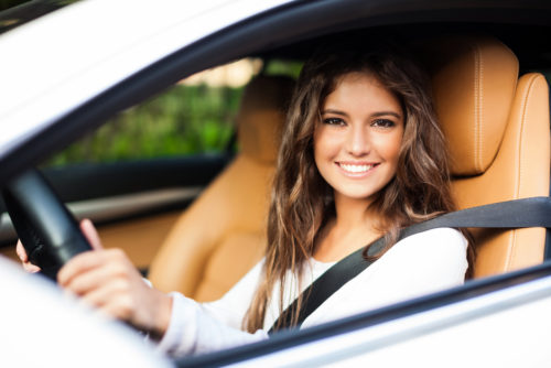 Female student in the driver’s seat of a car