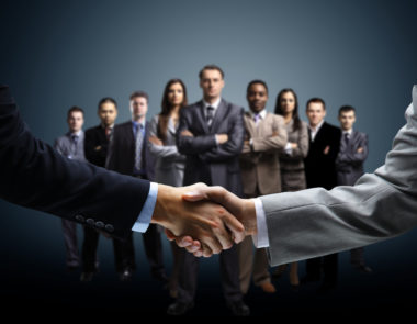 business people observe handshake
