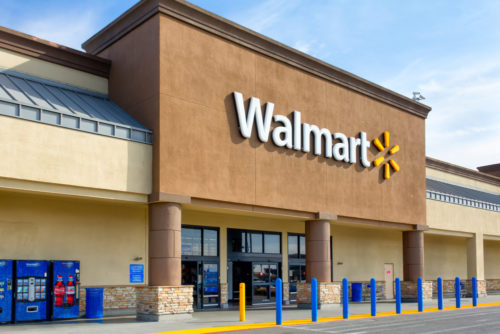 The exterior of a Walmart shopping center during the daytime.