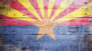 Arizona flag painted on a wooden background
