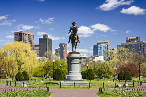 A statue in the Boston Public Garden during spring