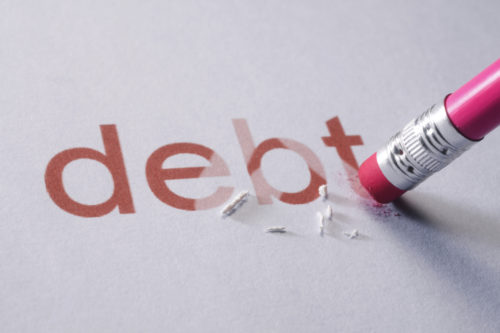An image of a pencil erasing the word "debt."