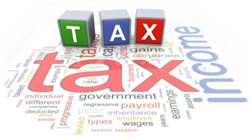 Three blocks spelling out tax and a word web of tax associated words