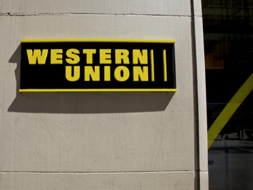 An image of the Western Union logo outside of a store.