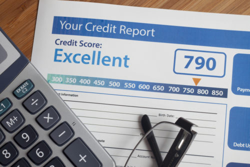 A credit report paper showing an excellent credit score of 790.
