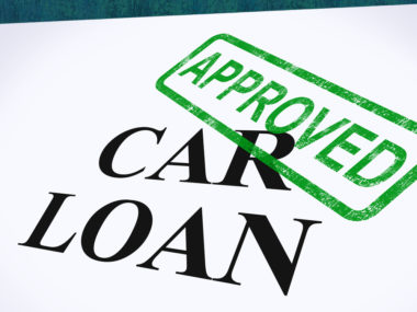 A graphic of an approved stamp on a car loan.