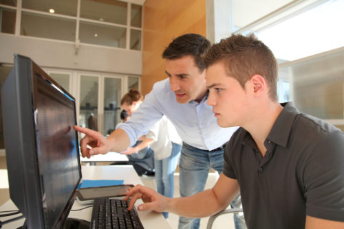 An intern receives guidance from a potential employer.