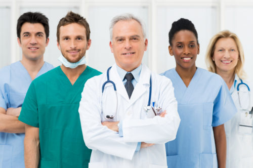 Various medical professionals standing next to each other.