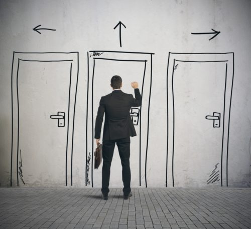 A graphic of a businessman in front of a choice of three drawn doors.
