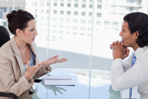An employee negotiating benefits with her employer.