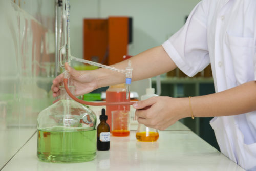 A biomedical engineer working in a lab.