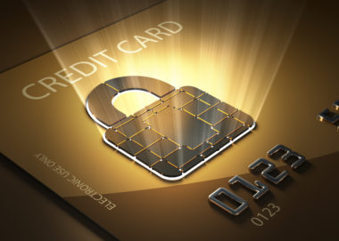 A credit card with a highlighted graphic of a lock on it, signifying a secure credit card transaction.