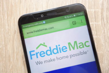 A smartphone screen displays the website to Freddie Mac.