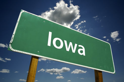 A road sign that reads "Iowa."