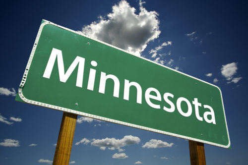 A road sign that reads "Minnesota."