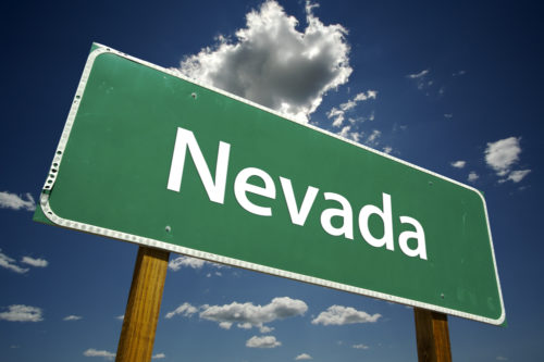 An image of a road sign that reads "Nevada."