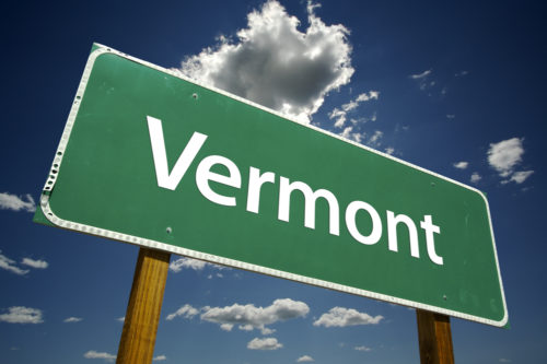 A road sign that reads "Vermont."