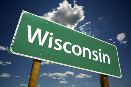 A road sign that reads "Wisconsin."