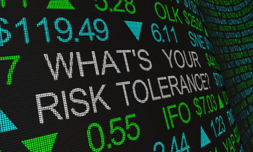 A stock exchange board displays many figures as well as the words "what's your risk tolerance."