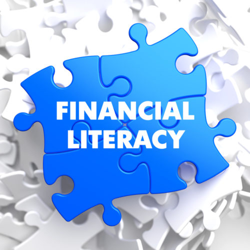 A graphic of puzzle pieces that spell the words "financial literacy" when formed together.