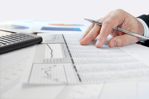 A businessman analyzing his company shares for equity financing.