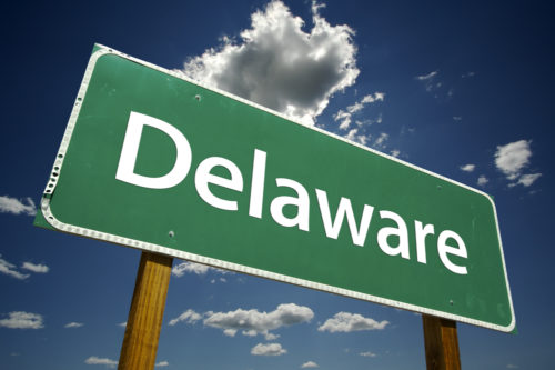 A road sign that reads "Delaware."