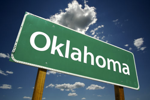 A road sign that reads "Oklahoma."