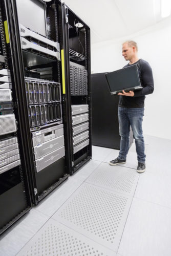 A cloud engineer working in a datacenter.