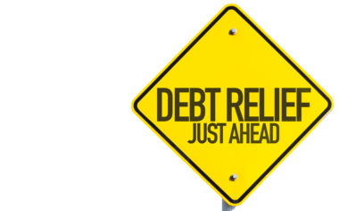 A yellow caution sign reads "debt relief just ahead."