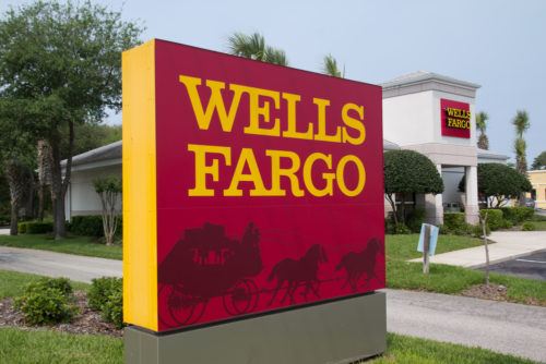 An image of the Wells Fargo sign outside of its bank branch.