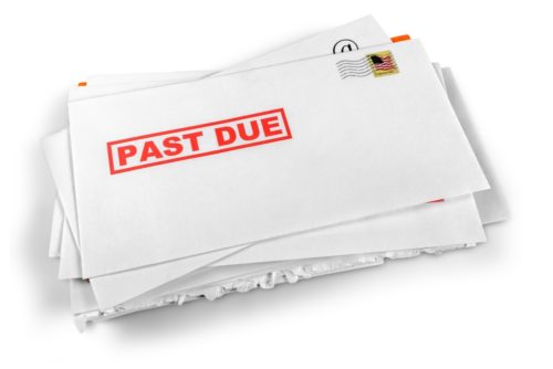 An envelope that is rubber stamped "past due."