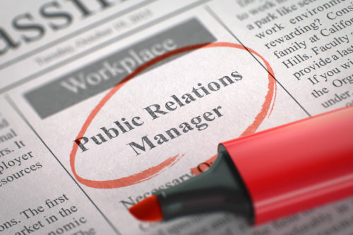 An advertisement in the classified section of the newspaper looking for a public relations manager.