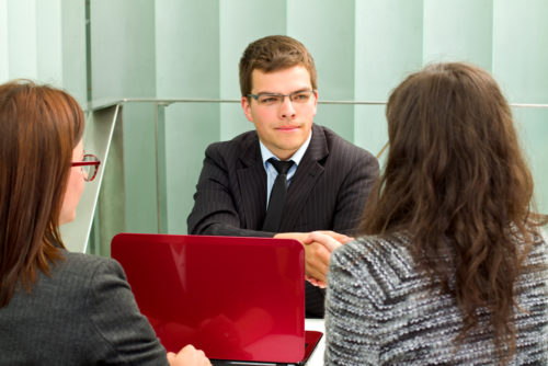 A banker meeting with clients.