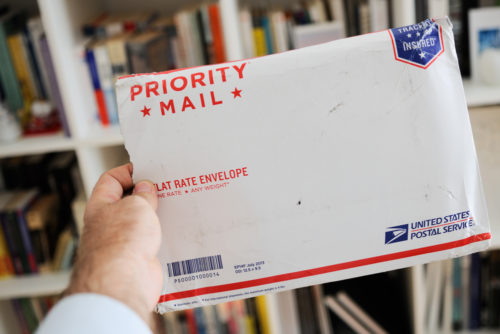 A USPS flat rate envelope marked "priority mail."