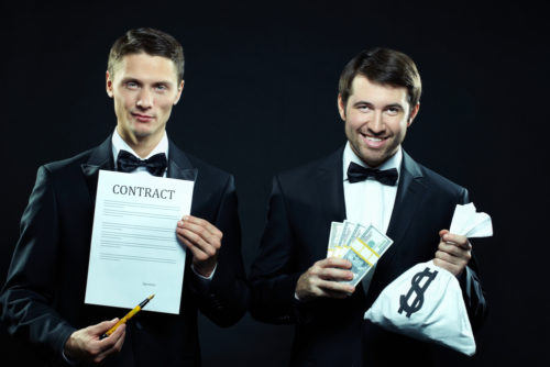 Two dishonest looking men, one holding a contract and pen and one holding a sack marked with a dollar sign.