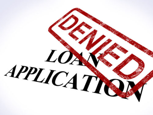 A loan application is stamped "denied."