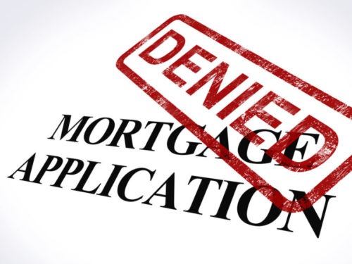 A mortgage application is stamped "denied."