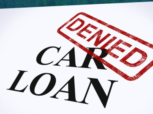 A car loan application is stamped "denied."