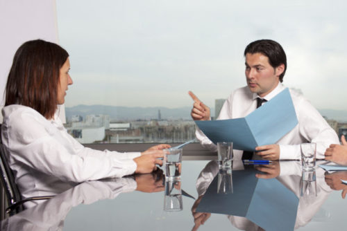 A lender speaking with a person who wants a loan.