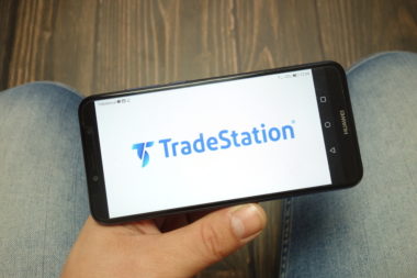 A smartphone's screen displays the TradeStation app.