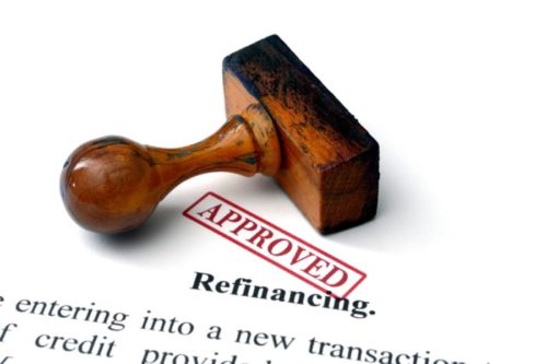 A refinancing contract is stamped "approved."
