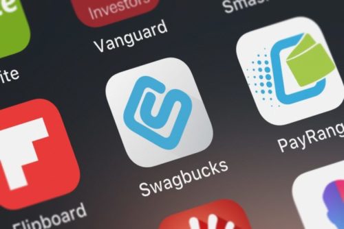 The screen of a smartphone displays the Swagbucks app icon.