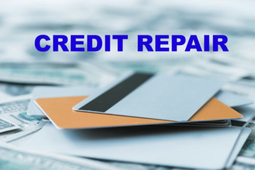 The words "credit repair" are superimposed over an image of a pile of credit cards and money.