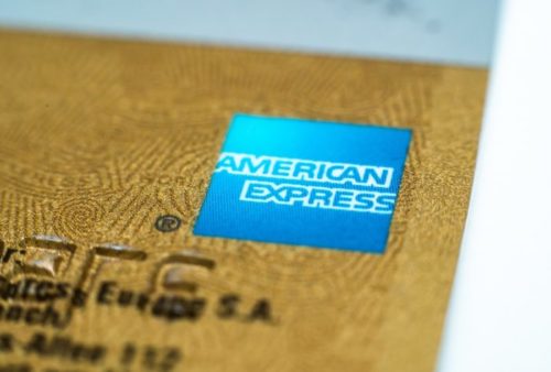 A closeup of a credit card shows the American Express logo.