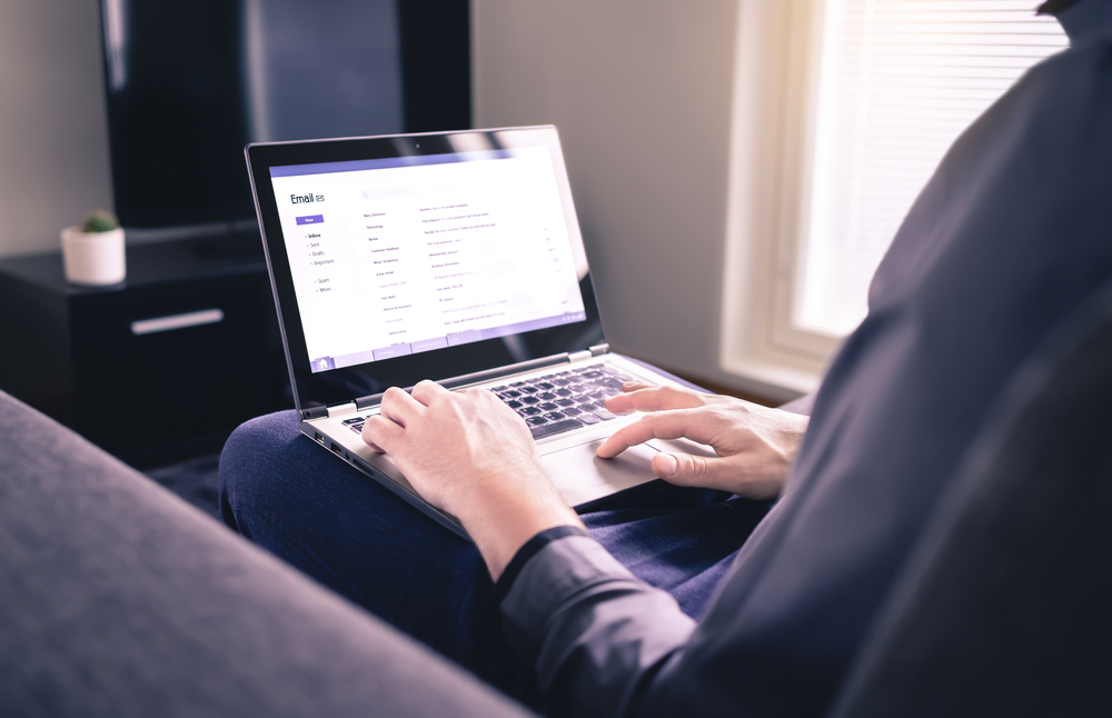 A person working on their laptop.