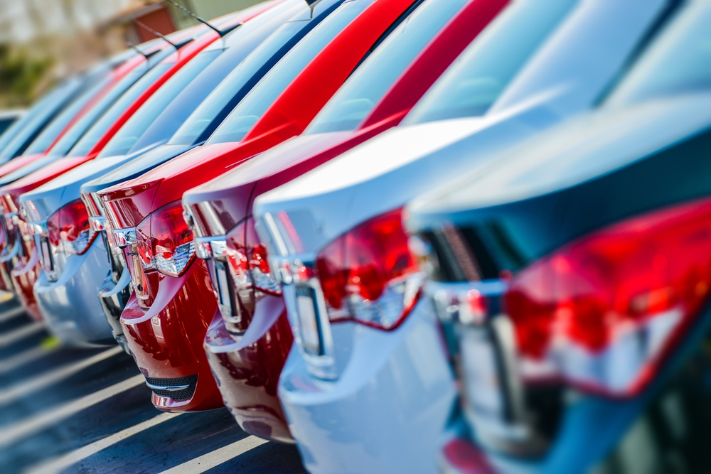 A row of cars at an auto dealership.
