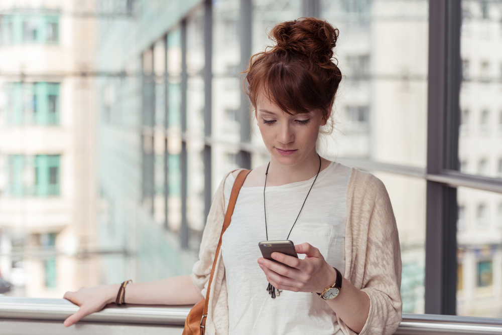 A person checks their phone.